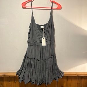 Short grey dress with adjustable straps. Never wore. Smoke free pet free home